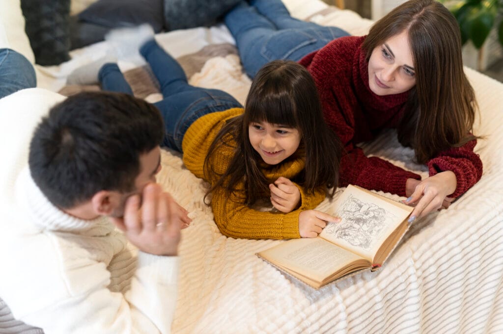 Parents telling stories to their child – ADA Holistic Learning approach to boost imagination and values